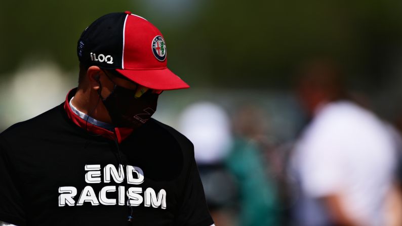 Formula One driver Kimi Raikkonen wears an "end racism" shirt before a race in Barcelona, Spain, on August 16.