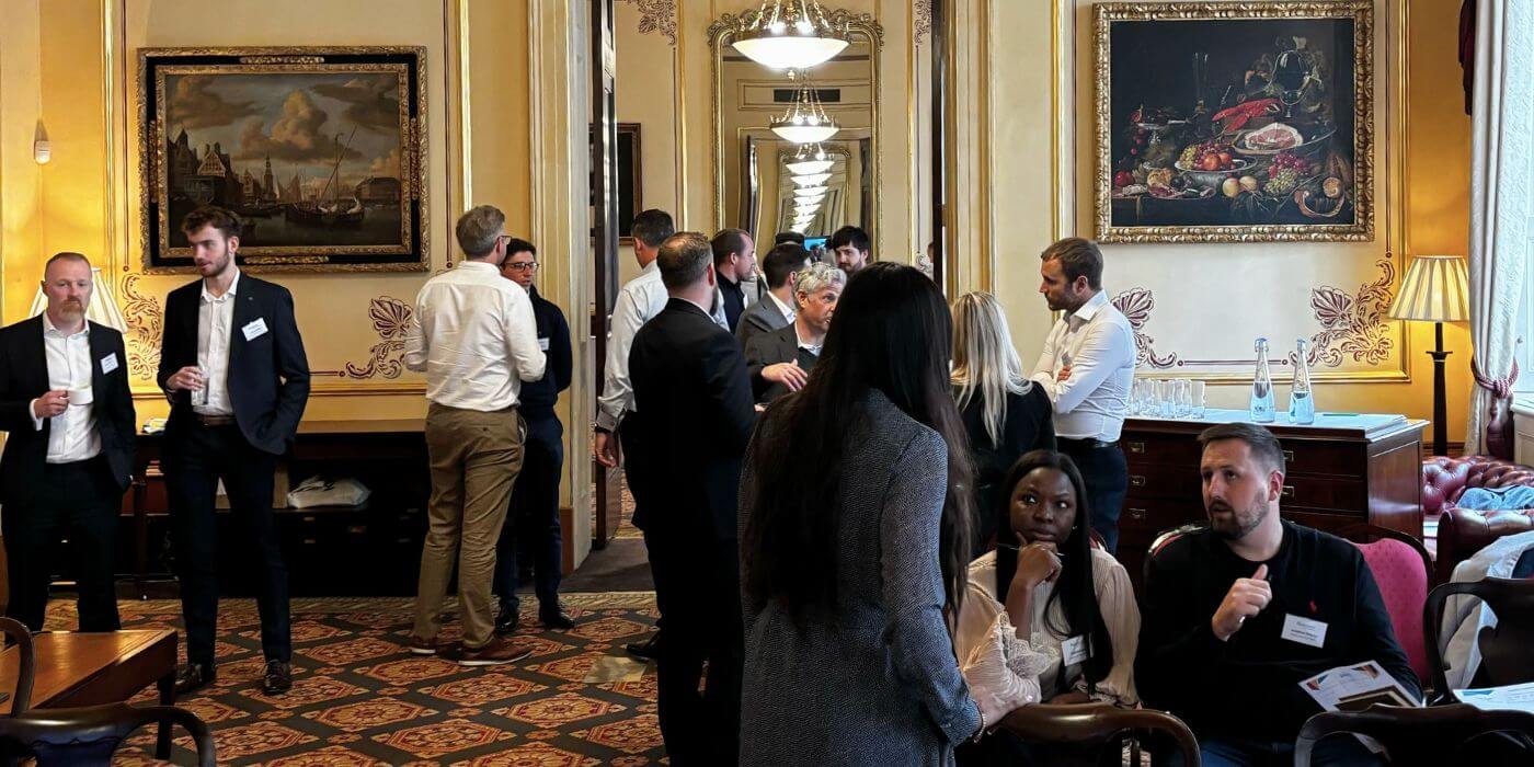 7 key takeaways from ascend london 2024: shaping the future of grc 6 Attendees at ascend london 2024 engaging in discussions during a networking session about the future of grc.