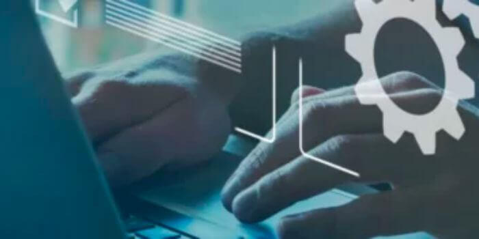 Hands typing on keyboard with digital icons floating above representing grc processes